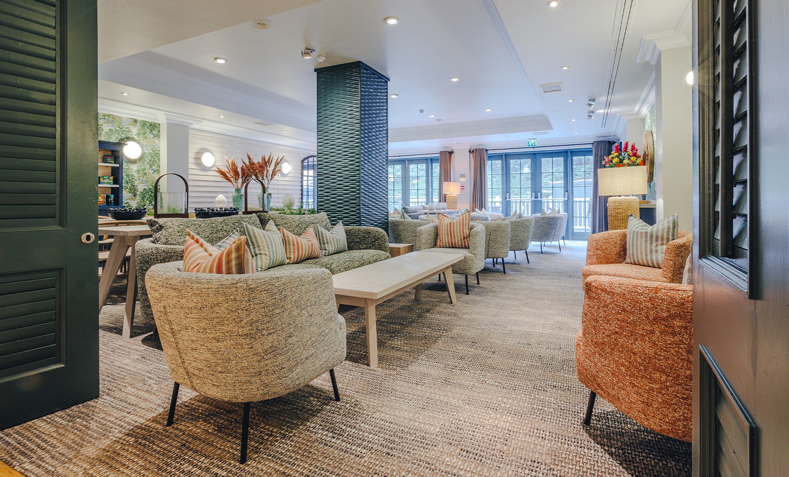The inviting Garden Room lounge set beside The Spa is a welcoming space for well-being.