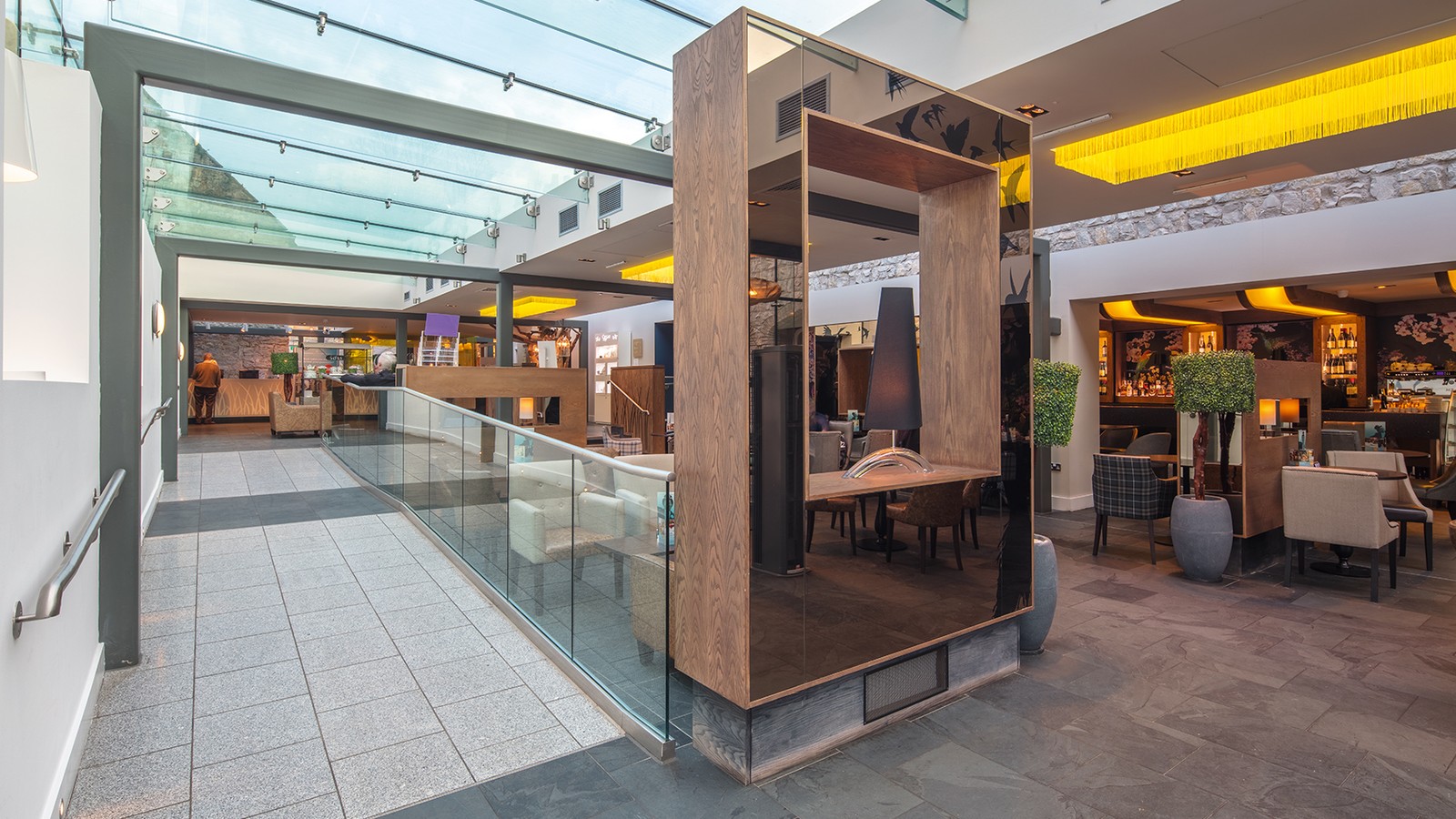 Enter the atrium and be greeted by our reception, with a bar nearby where you can relax and settle in after your travels.