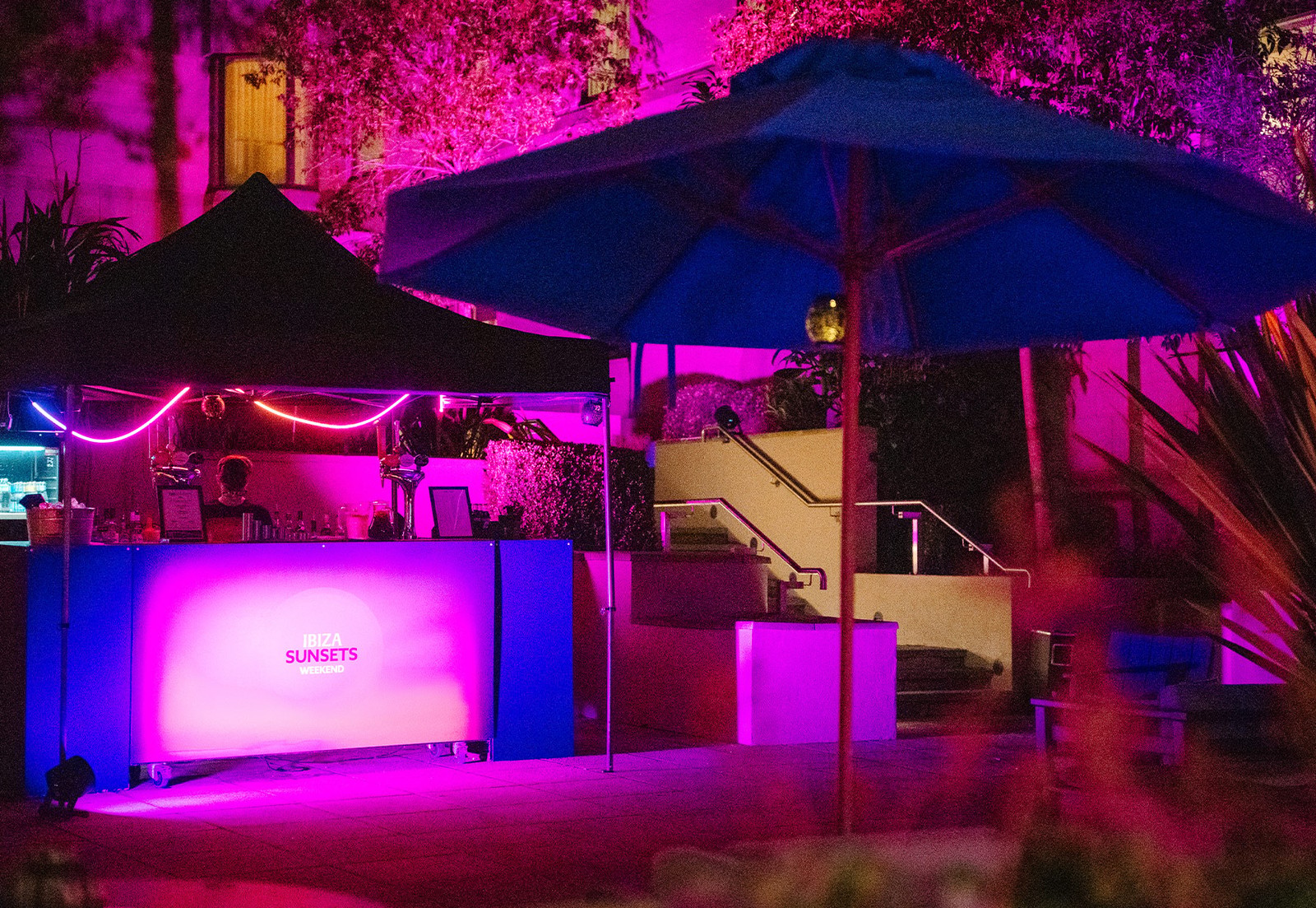 A touch of neon, a hint of evening magic - your perfect spot to unwind.
