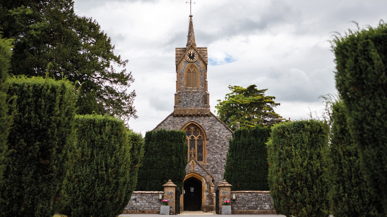 View of the Church on Cricket St. Thomas grounds featuring lush greenery ideal for country strolls