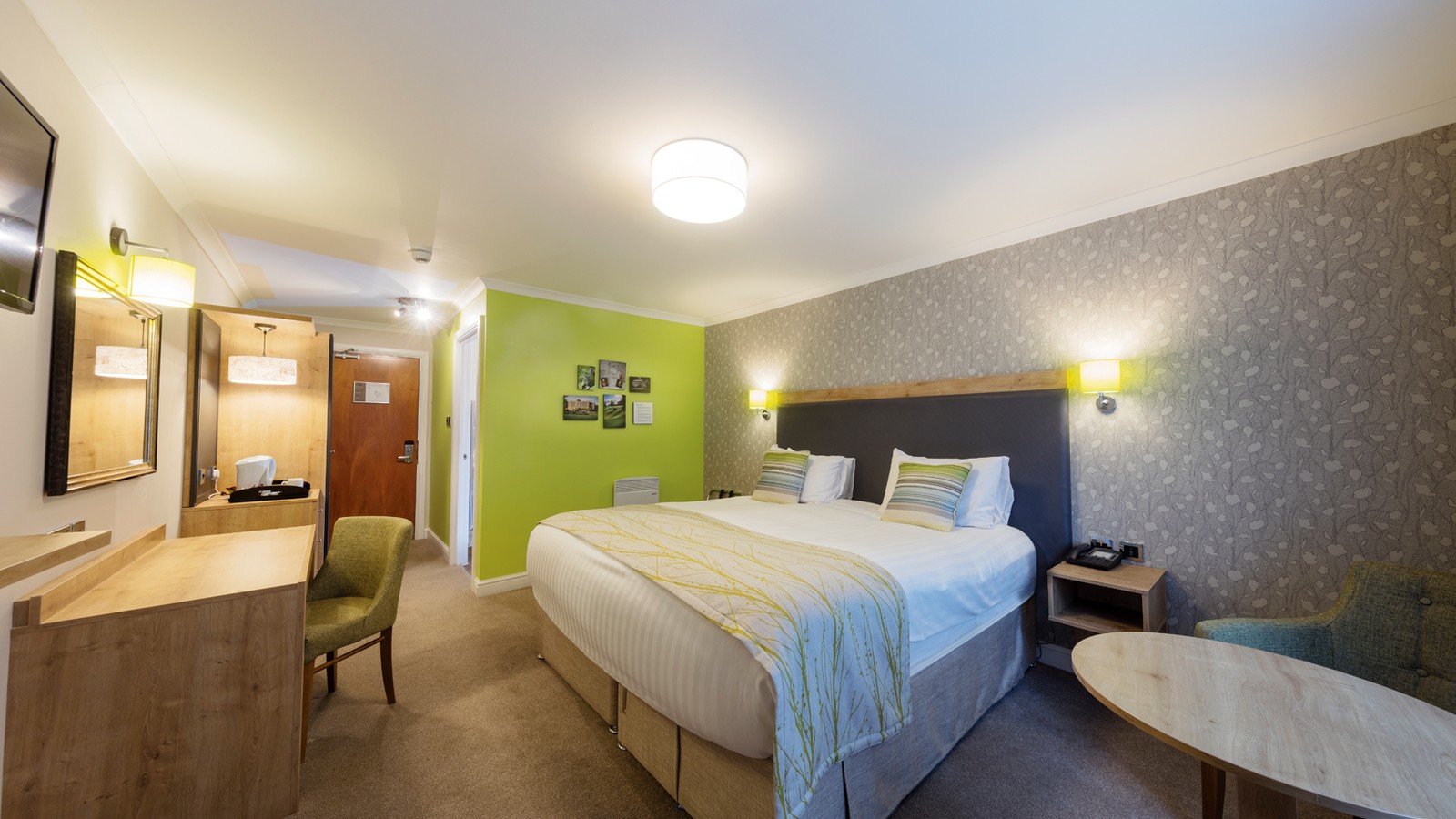 Standard bedroom featuring all modern comforts in a light and airy room.