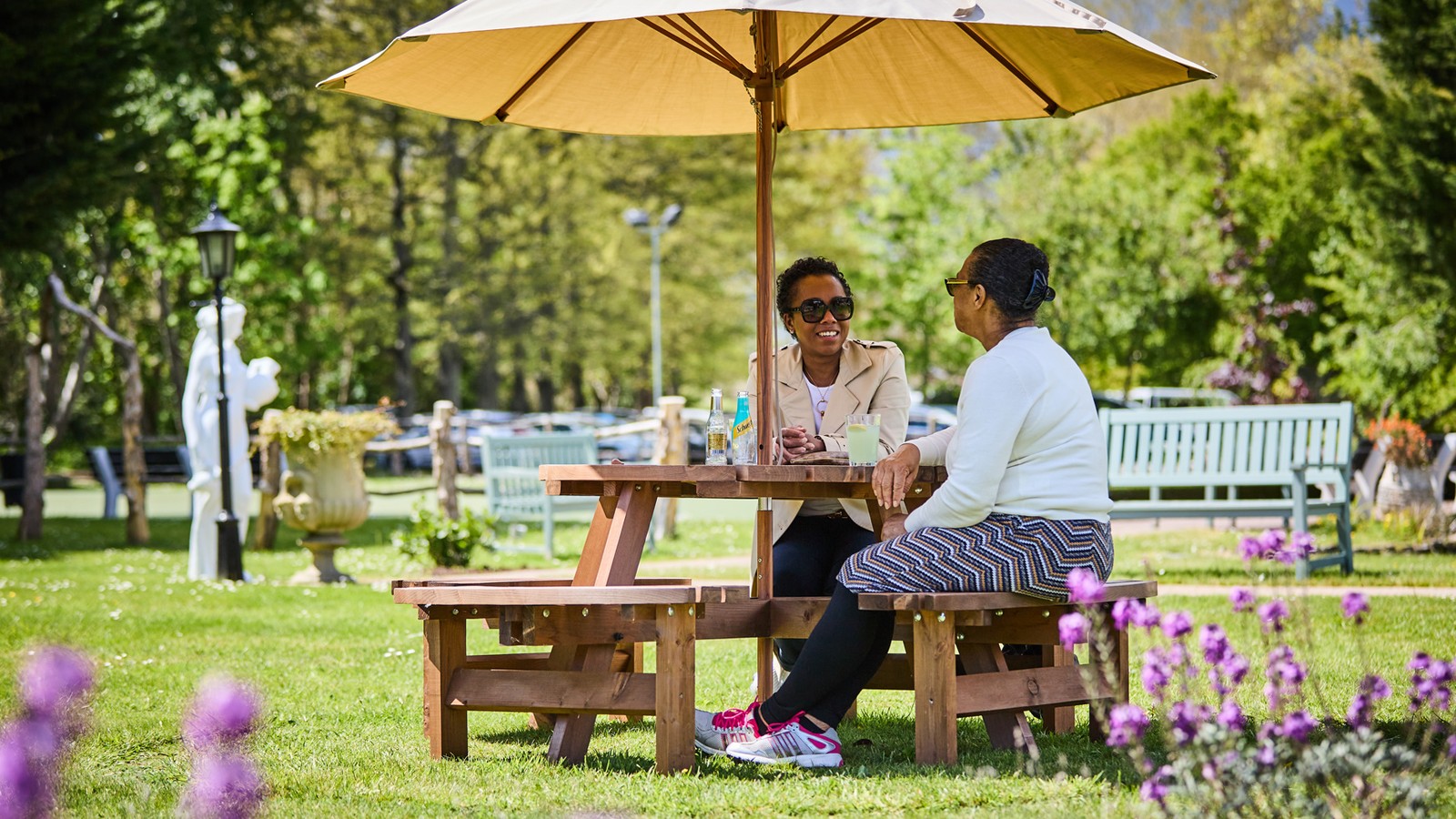 Outdoor seating area on the grounds with comfortable seating and shade options.