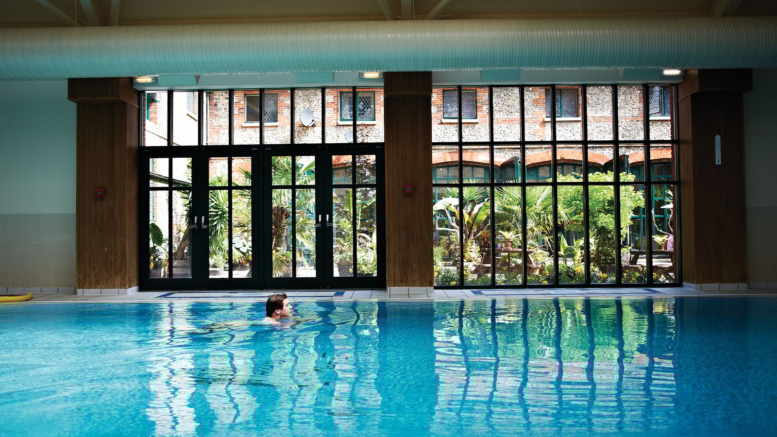 Indoor pool with courtyard view.