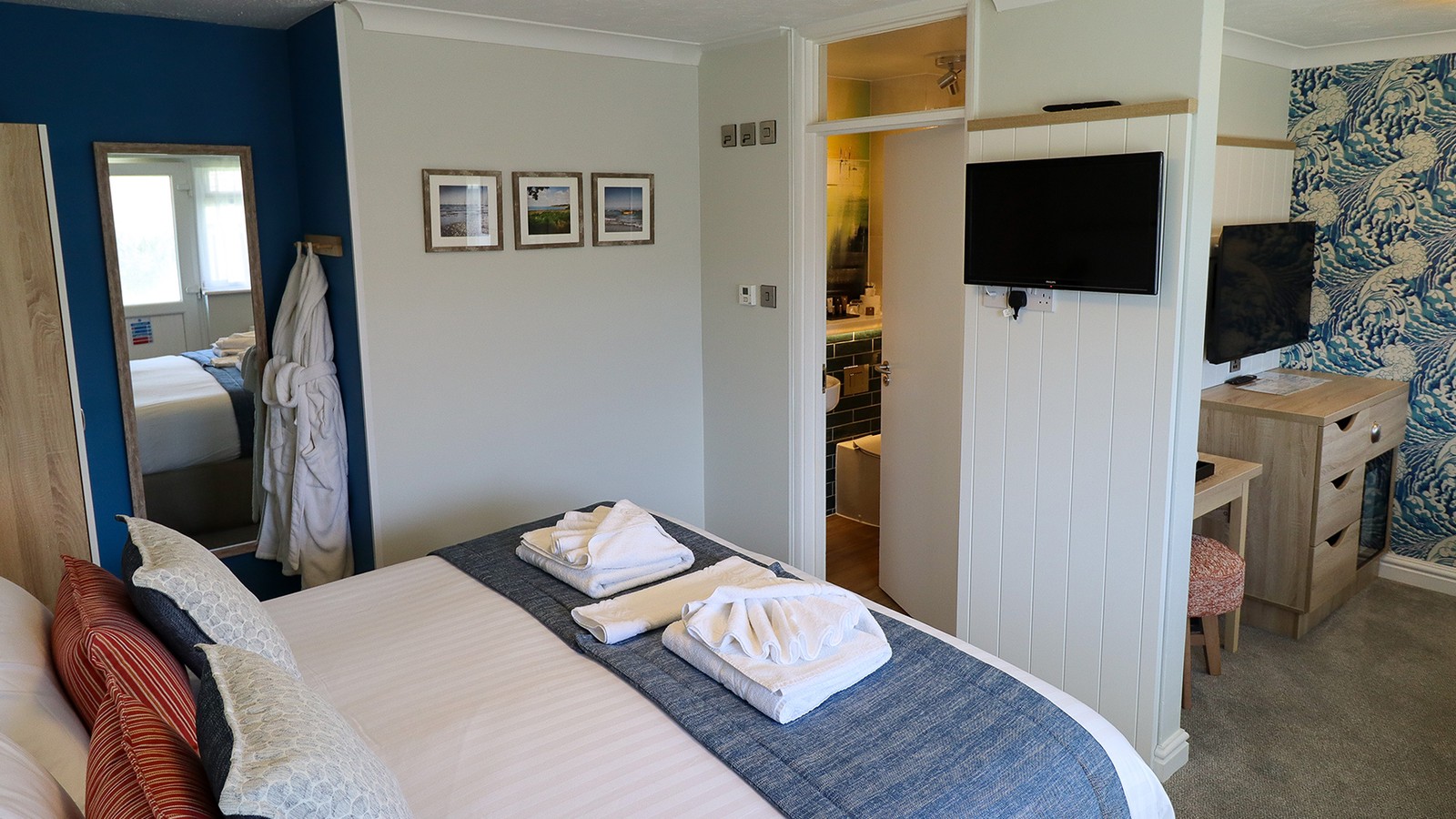 A Premier Chalet with a comfortable bed, en-suite bathroom and wide screen TVs.