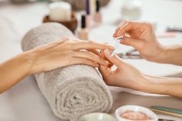 Woman's nails being filed