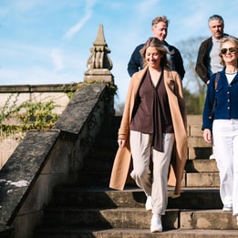 A group of people going down the steps at Thoresby Hall
