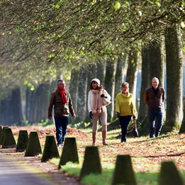 Guests walking through the grounds of Littlecote House Hotel