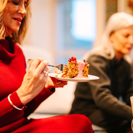 Close up of a guest enjoying a delicious festive treat from the Coffee Nest