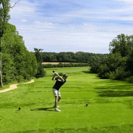 Man taking a swing on the golf course