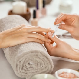 Woman's nails being filed