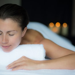 Person looking relaxed as they lay ready for a massage