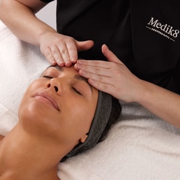 women in medik8 shirt giving a massage