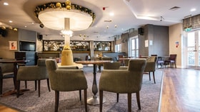 Contemporary hotel lounge bar with comfortable seating, modern décor and spacious social areas.