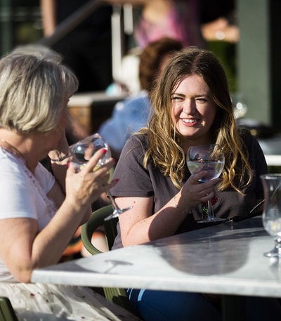 Guests enjoying gin and tonics on the Arden Terrace at Studley Castle