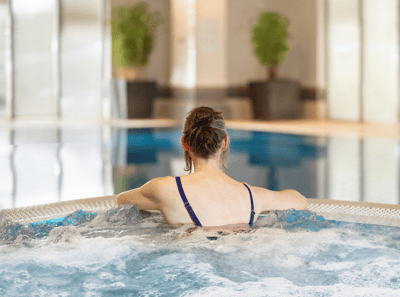 Lady enjoying the pool at The Runnymede on Thames