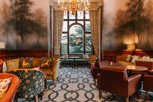 Where modern comfort meets timeless charm - unwind in the refreshed Manvers Bar.