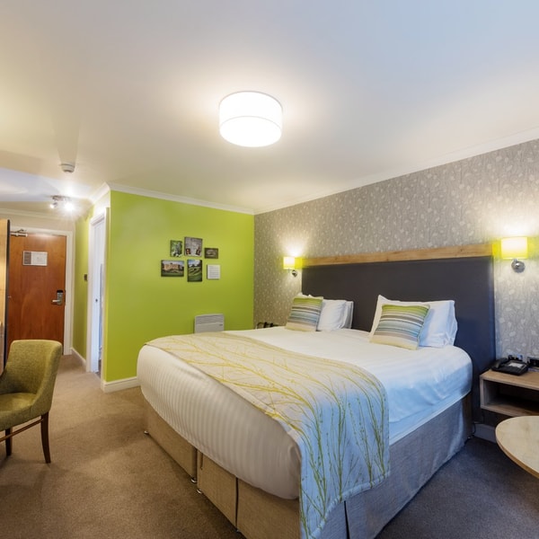 Standard bedroom featuring all modern comforts in a light and airy room.