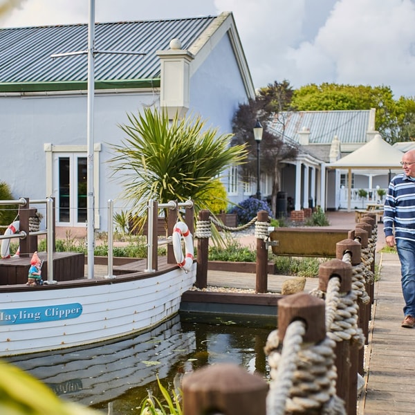 View of the lake and island features with well maintained lawns.