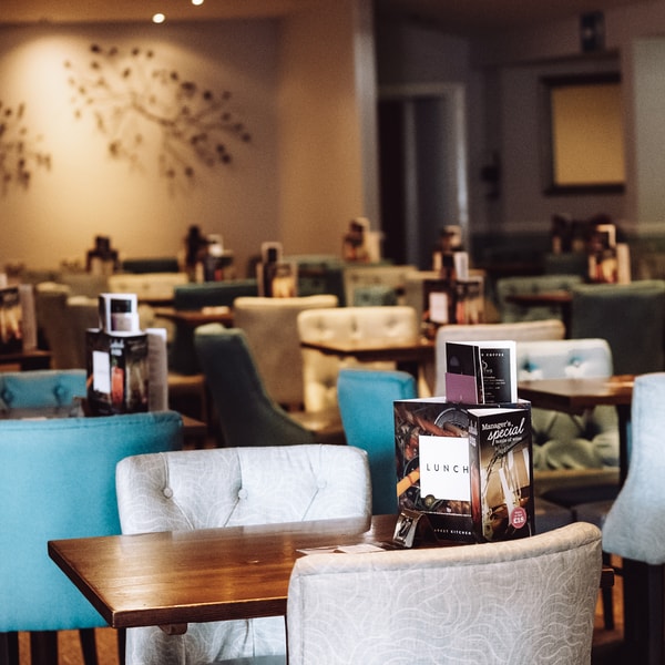 The piano bar with comfortable seating and soft lighting.