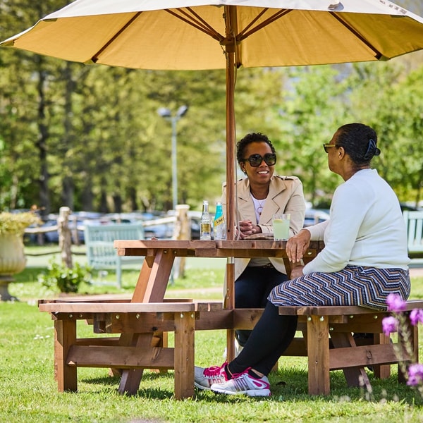Outdoor seating area on the grounds with comfortable seating and shade options.