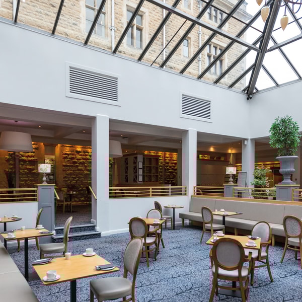 The Sherwood Restaurant is home to the Market Kitchen. Situated within what was previously a courtyard, the original outer walls reflect the buildings historic roots and the glass roof allows natural light to flood in.
