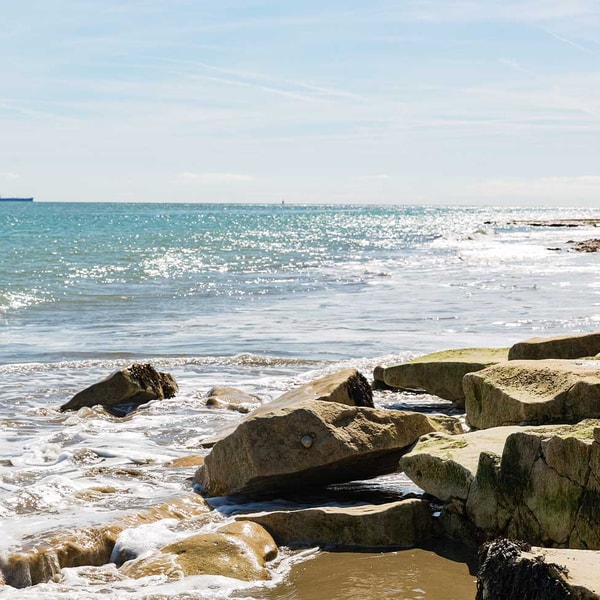 There's nothing quite like the sound of waves crashing against the rocks and the fresh sea breeze on your face.