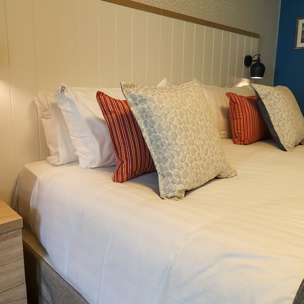 Sink into clean and comfortable sheets in your Premier Chalet.