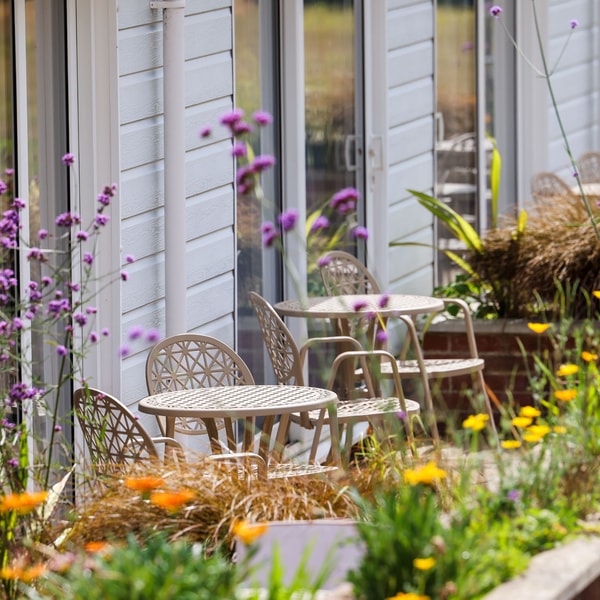 The Garden Suites are highly sought after - patios, comfy seating, and a backdrop of vibrant flowers make them simply irresistible.