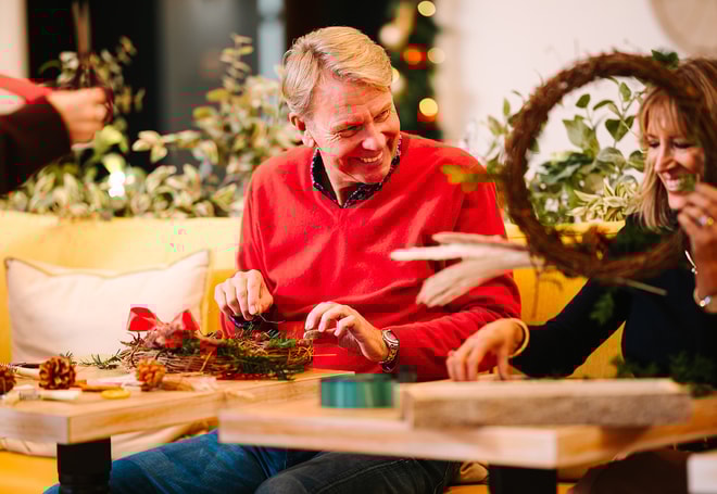 Guests creating their own christmas wreaths