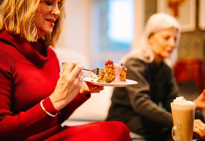 Close up of a guest enjoying a delicious festive treat from the Coffee Nest