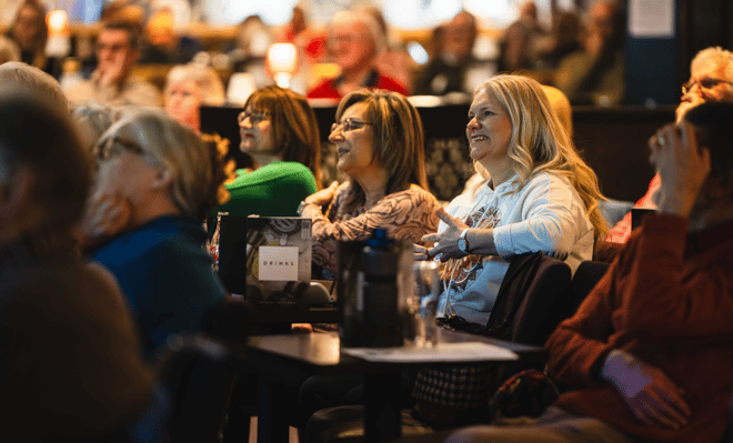 Group of people watching the evening entertainment