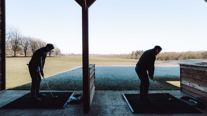 Guests practising swings in driving range