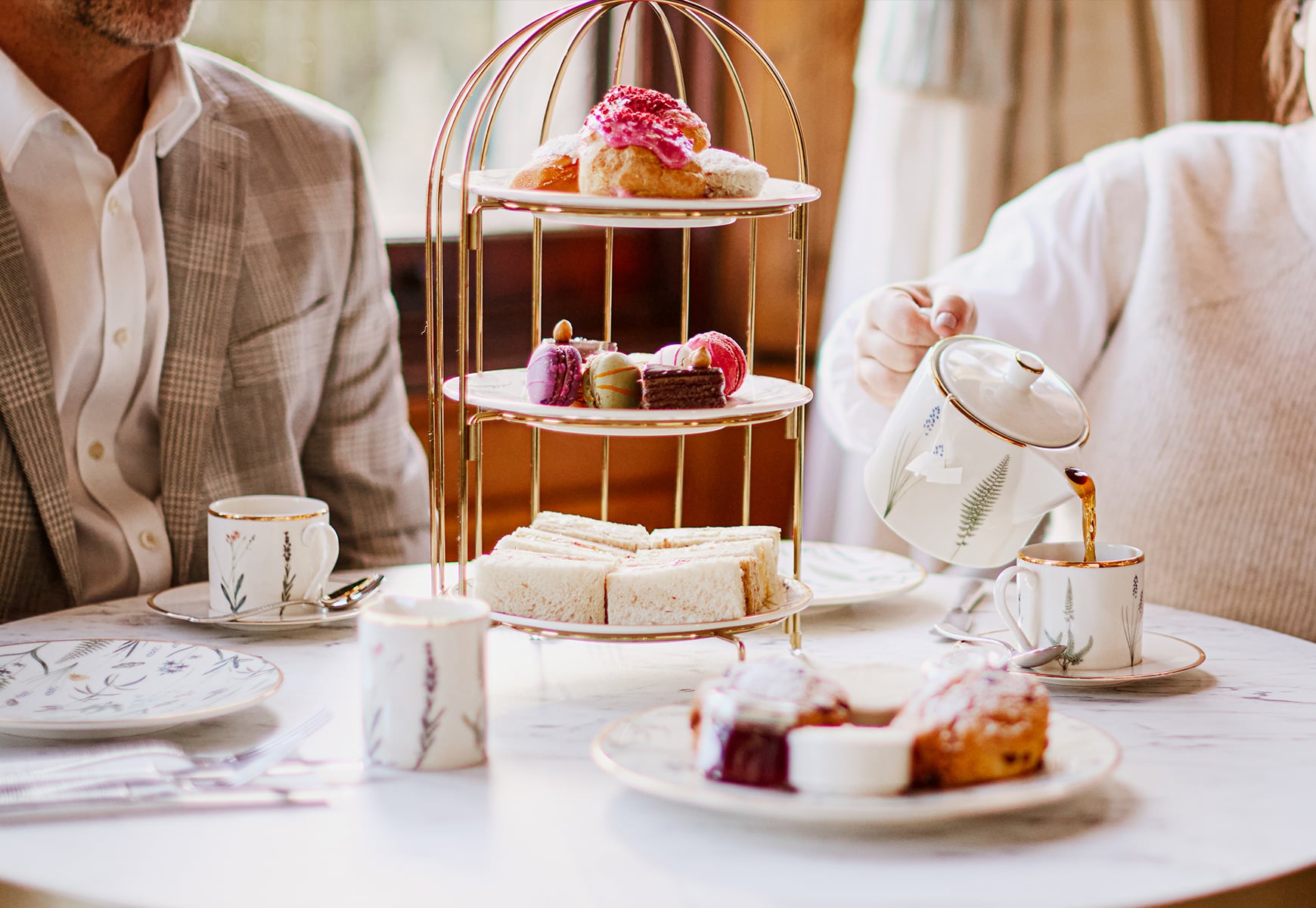 An afternoon tea set up on a stand