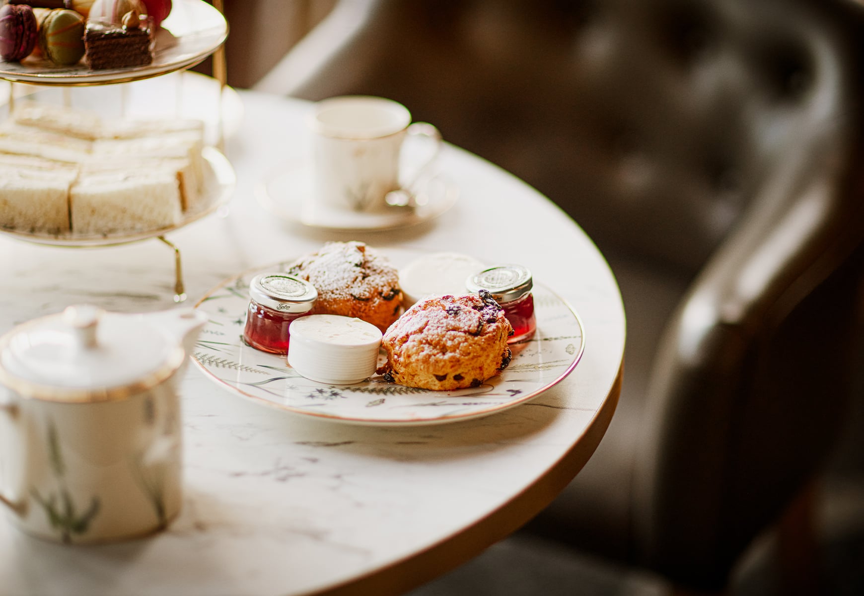 Scones on a plate with jam and cream