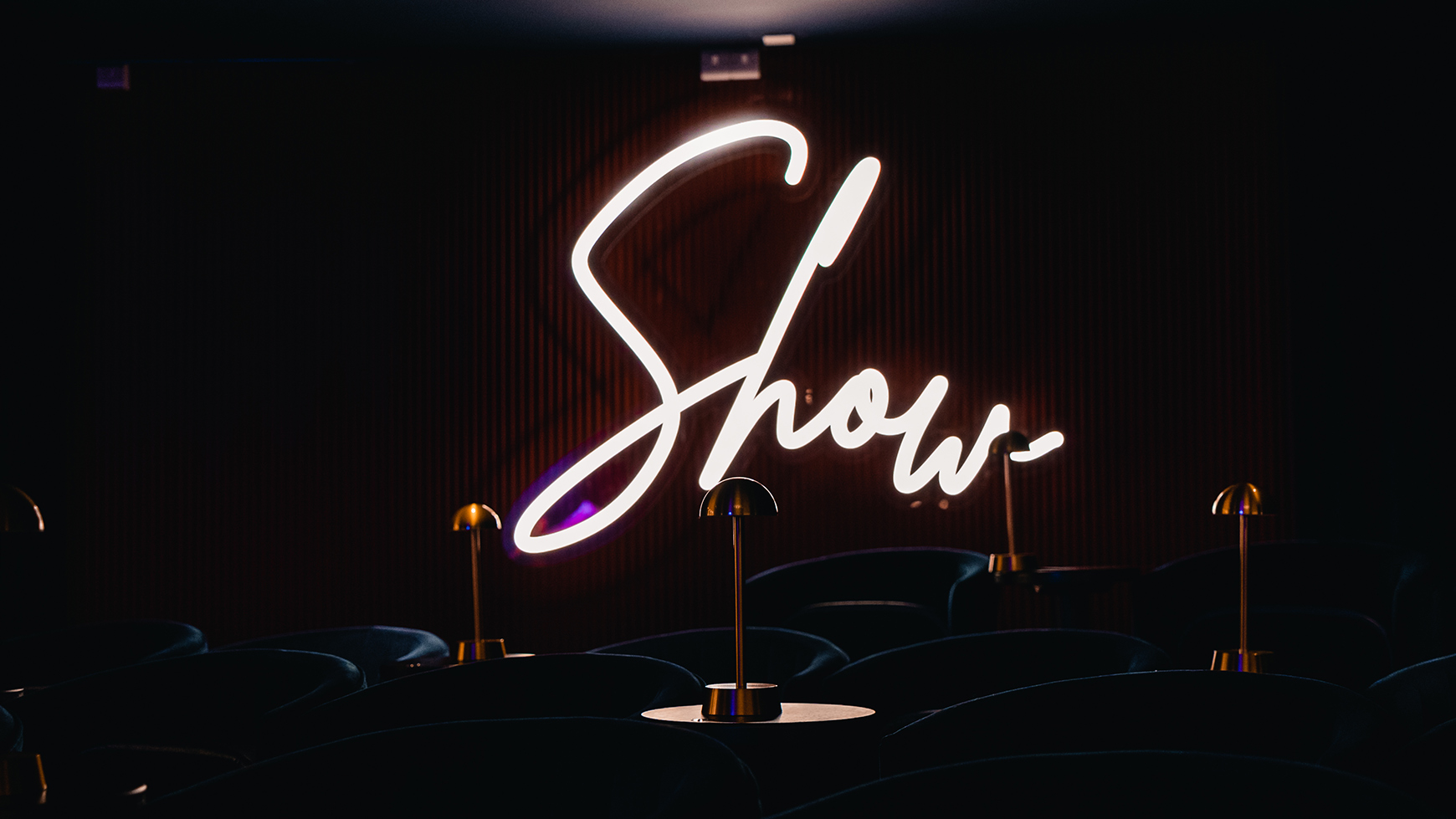 A neon sign that says 'Show'