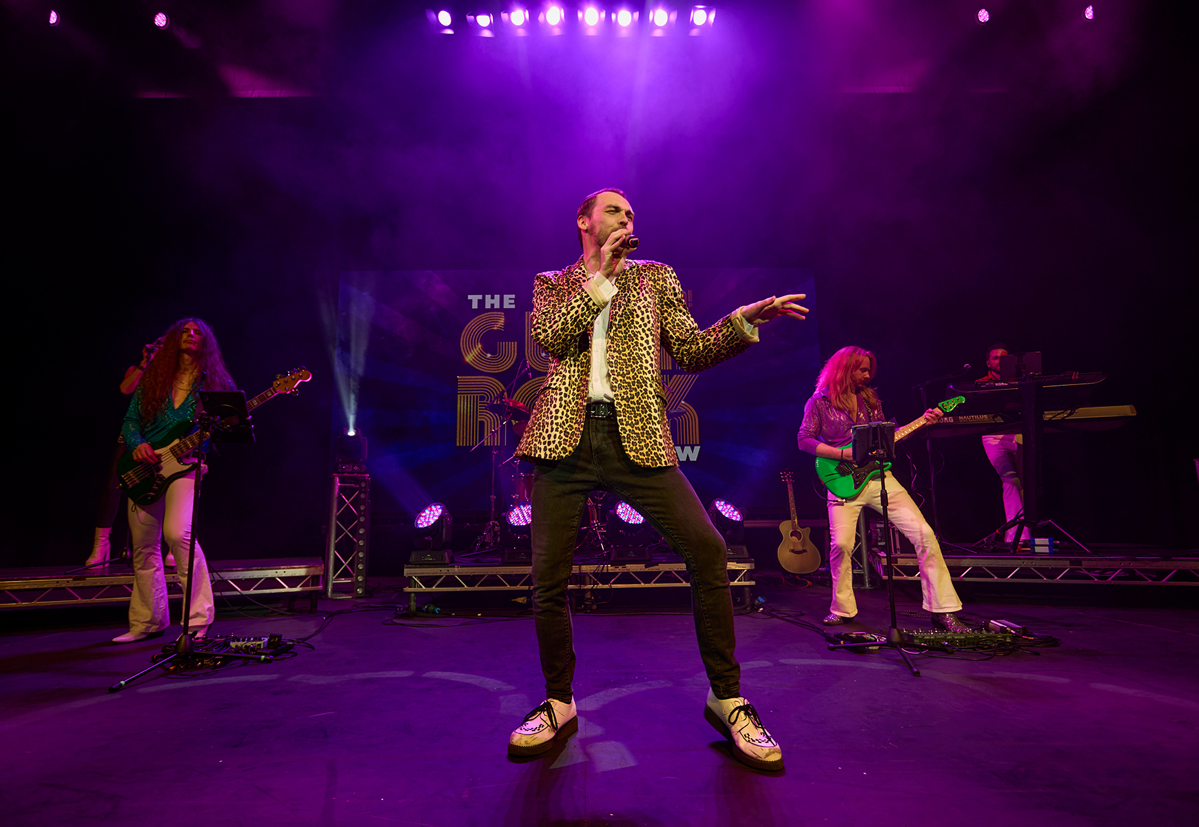 The Glam Rock Show performing on stage